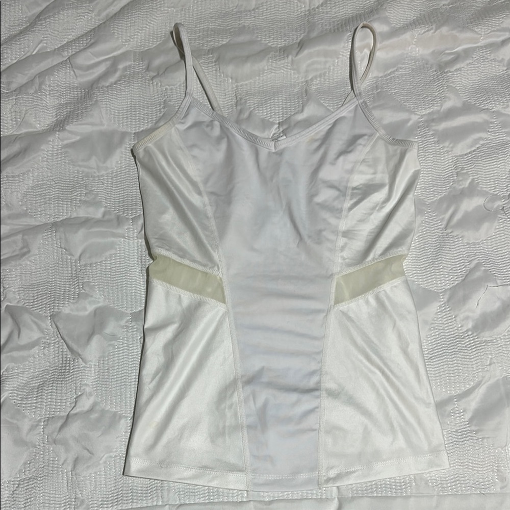 White Fabletics tank with mesh details